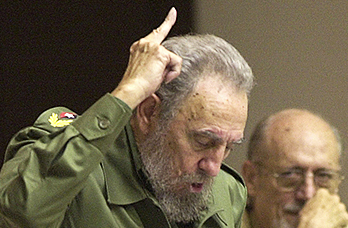 Cuba's leader Fidel Castro, left, votes in favor of the modification on the Cuban Constitution in this 2002 photo, as his brother, Defense Minister Raul Castro, looks on during an extraordinary National Assembly session in the Convention Palace in Havana, Cuba. Fidel Castro led a rebel army to improbable victory in Cuba, embraced Soviet-style communism and defied the power of 10 U.S. presidents during his half century rule. Associated Press File Photo/Cristobal Herrera