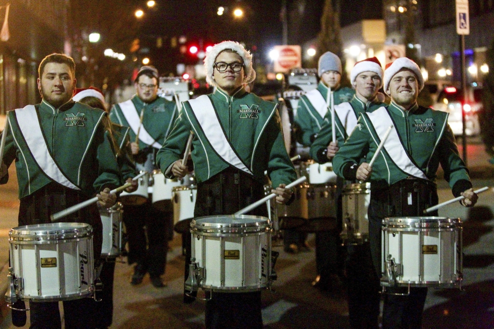 Percussionists from Marshall University's Marching Thunder drum line perform their "Eleven Drummers Drumming" show in the streets of downtown Huntington, W.Va., in 2014.