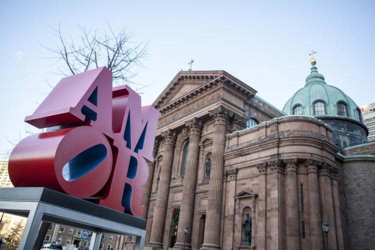 Robert Indiana's AMOR sculpture occupies a spot in a park outside Philadelphia's Cathedral Basilica of Saints Peter and Paul. Officials say the sculpture, originally loaned to Philadelphia for last year's papal visit, will permanently remain in the city.