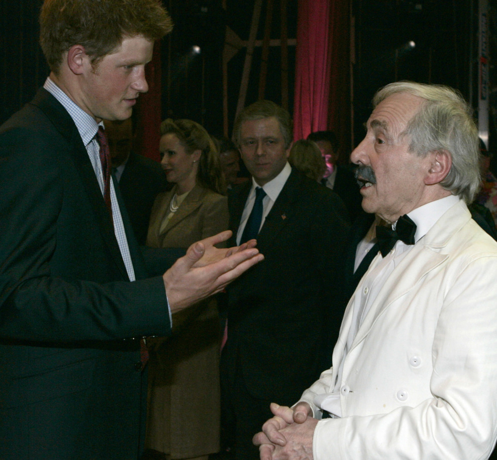 Britain's Prince Harry talks to actor Andrew Sachs backstage at the Wimbledon Theatre after a charity performance in aid of the Prince's Trust charity in 2008.