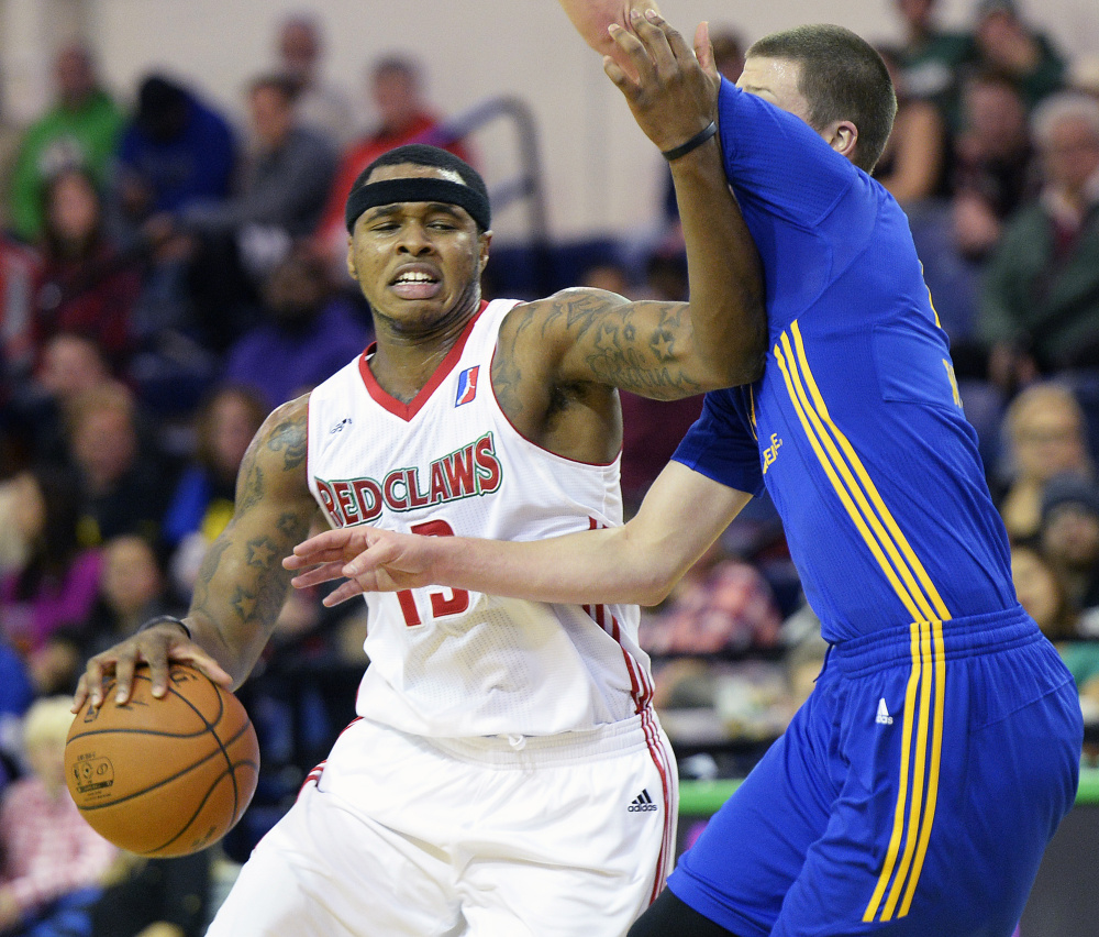 Marcus Georges-Hunt of the Maine Red Claws drives to basket against Scott Wood of the Santa Cruz Warriors on Saturday at the Portland Expo. The Red Claws rallied for a 115-106 win. (Shawn Patrick Ouellette/Staff Photographer)