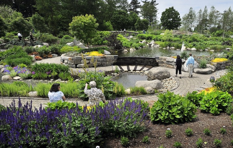 Visitors sit and walk in the Lerner Garden of the Five Senses at the Coastal Maine Botanical Gardens in Boothbay in 2016. The 300-acre attraction first announced its plans to expand in late 2015. 