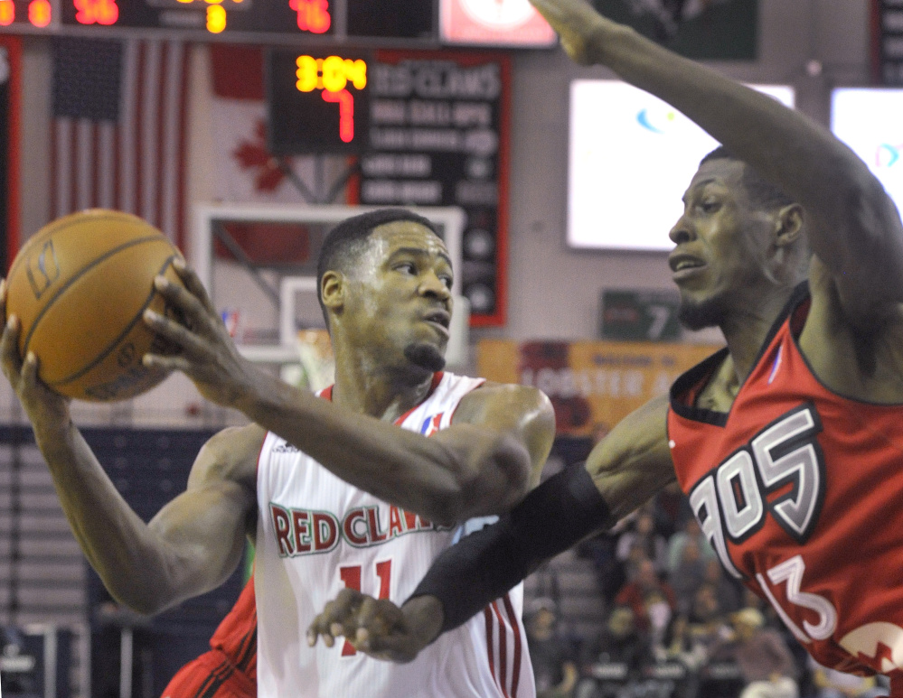 Maine's Demetrius Jackson, left, looks to make a pass while being defended by Raptors 905's Antwaine Wiggins during the Red Claws' 102-89 loss on Sunday.