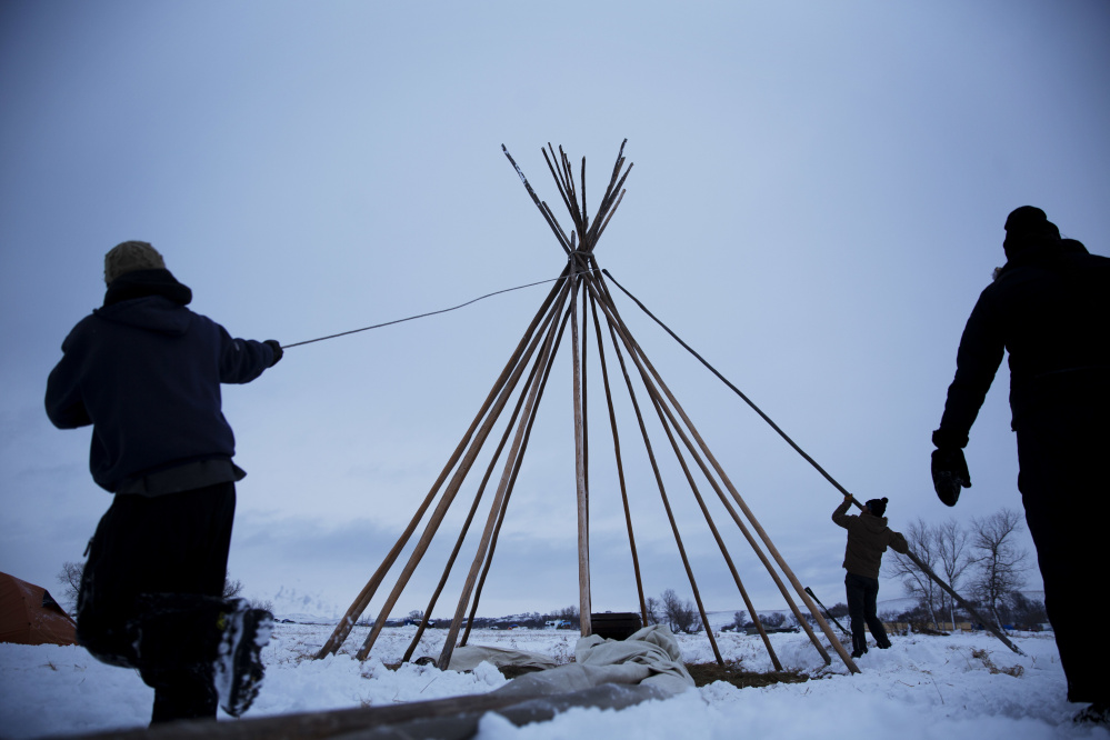 Campers from Colorado set up a teepee at the Oceti Sakowin camp, where people have gathered to protest the Dakota Access oil pipeline near Cannon Ball, North Dakota, on Nov. 30.