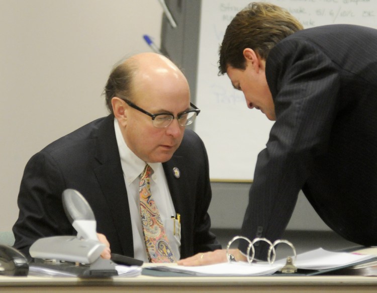 Newell Augur of the No on 1 Campaign, right, confers Monday with Secretary of State Matt Dunlap during a recount in Augusta on the referendum question to legalize recreational marijuana in Maine.