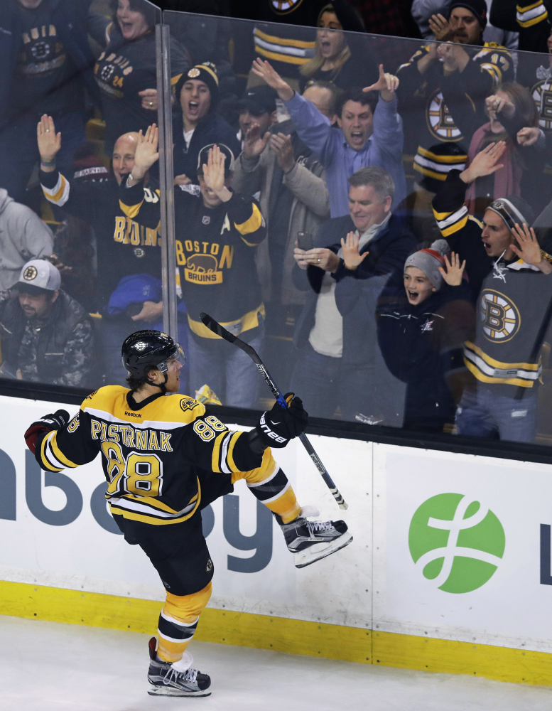 David Pastrnak celebrates his game-winning goal against Florida in overtime. It was his second goal of the game.
