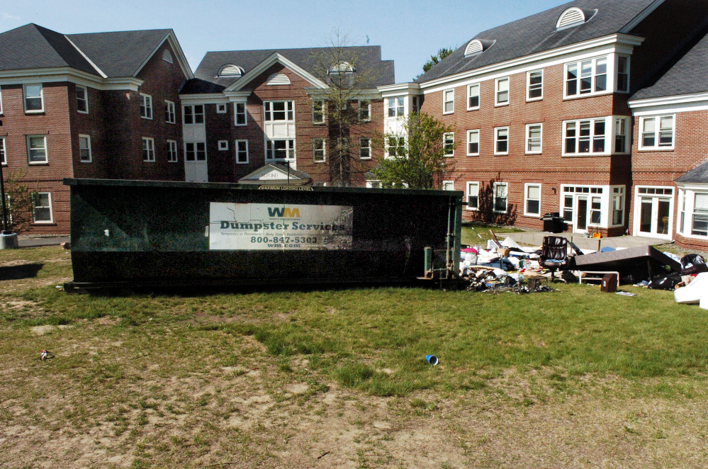 A dumpster loaded with items from students leaving for the summer was ignited on the Waterville campus in May. Three former students pleaded guilty to criminal mischief charges.