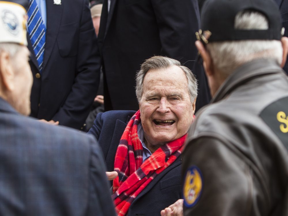 Former President George H.W. Bush greets World War II veterans at the conclusion of a Pearl Harbor remembrance ceremony at the George Bush Presidential Library Dec. 7, 2016, in College Station, Texas.