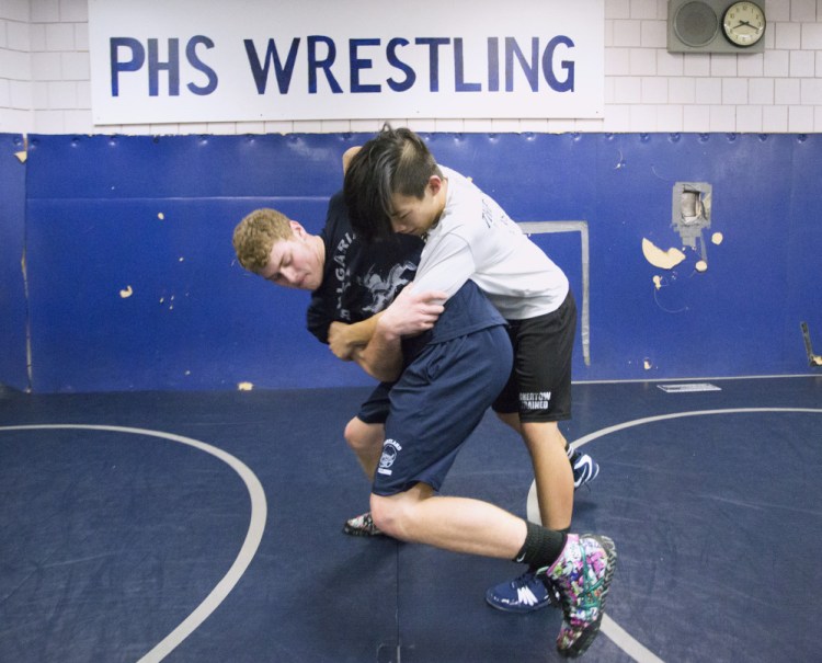 Portland High wrestlers Zach Elowitch, left, and Ben Levine start their drive toward a state championship come February, but both began before high school in a feeder program that benefits Portland, Deering and Cheverus.
