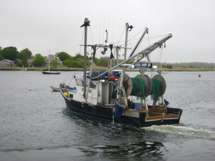 Fishing captain Jim Ford prepares to head to sea in the Lisa Ann III out of Newburyport, Massachusetts. Two net drums are fitted on the stern, so the ultra low opening trawl net and a traditional trawl can be testing alternatively.