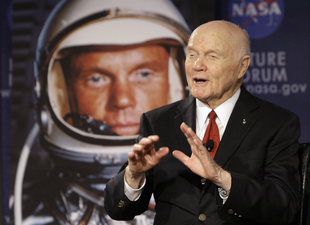 John Glenn talks with astronauts on the International Space Station via satellite in 2012. He said space travel strengthened his faith in God.