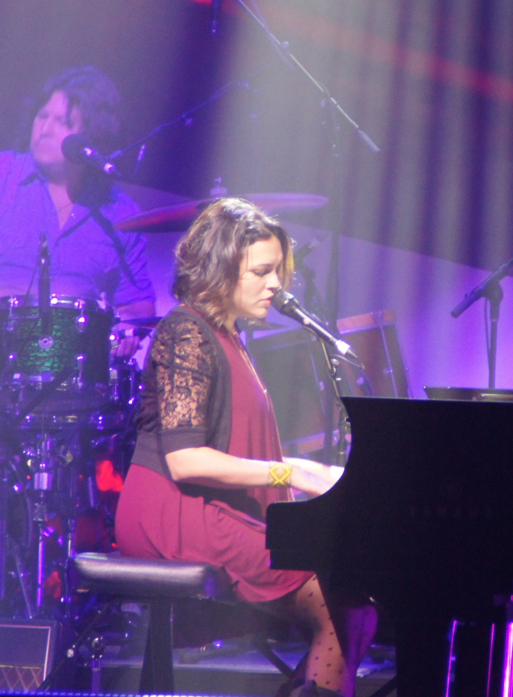 At ease on piano and guitar, Norah Jones shows her versatility Friday night at the  State Theatre while promoting her new album.