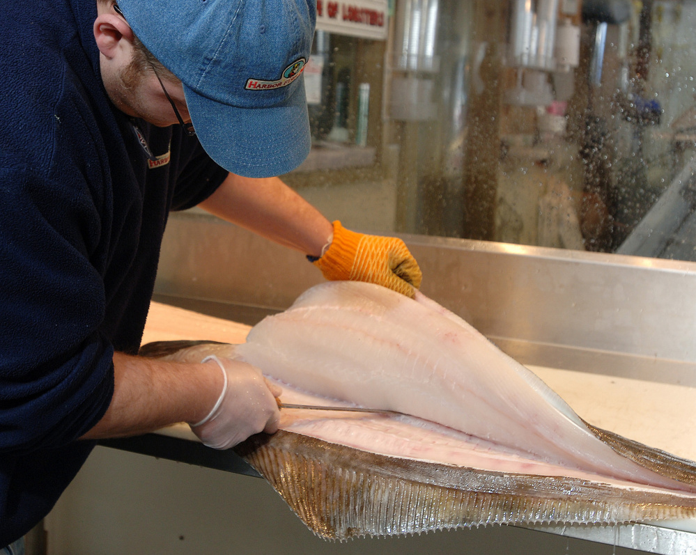 The 30-pound halibut being filleted by Jason Smith at Portland's Harbor Fish in 2006 would now have higher value.