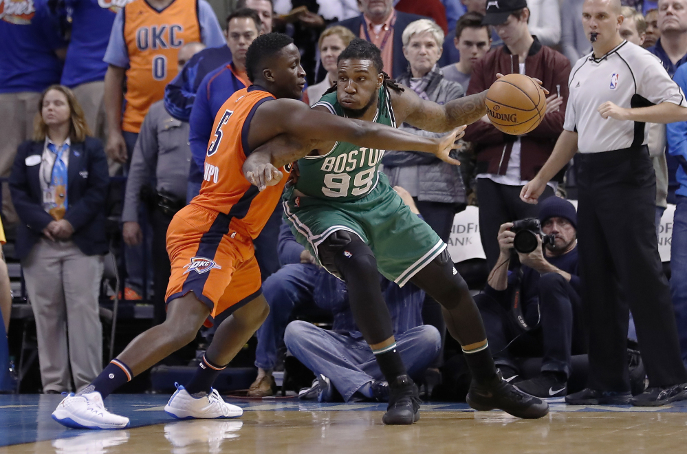 Boston Celtics forward Jae Crowder (99) drives to the basket as Oklahoma City Thunder guard Victor Oladipo (5) defends during the first half.