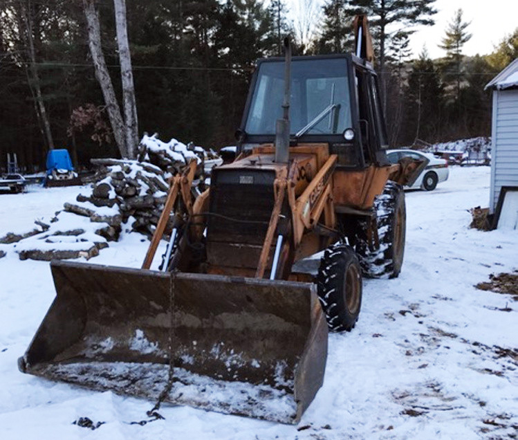 John Bubar allegedly used this front-end loader to pick up the mobile home and drop it on the ground three times. 