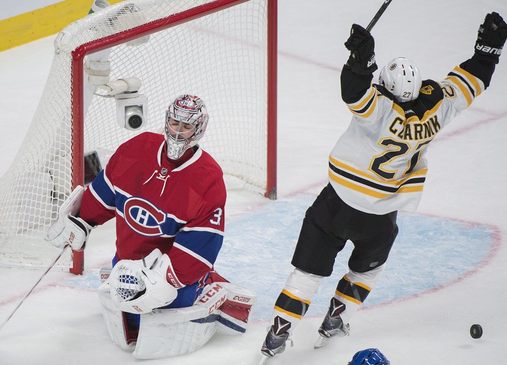The Bruins' Austin Czarnik celebrates after scoring against Canadiens goaltender Carey Price in the second period Monday night in Montreal.