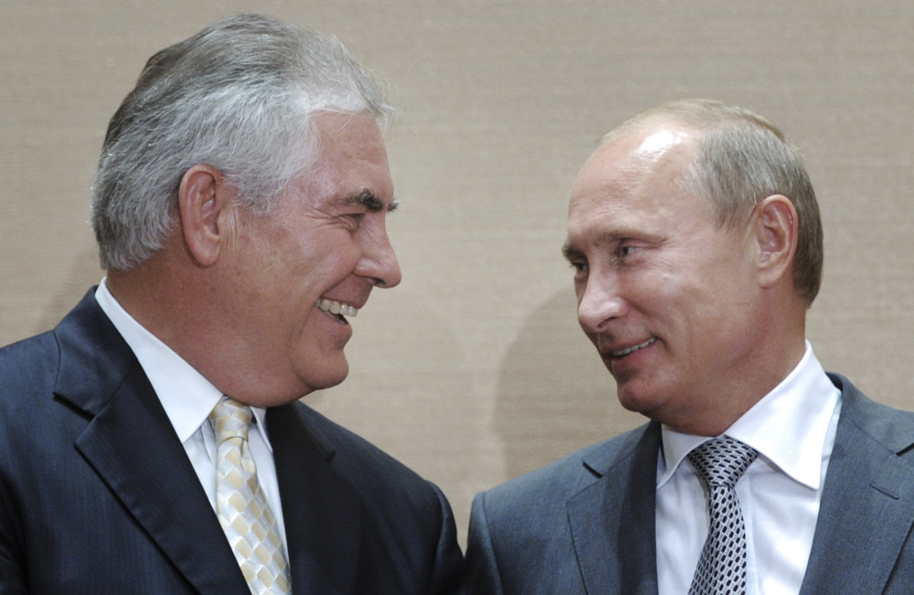 Rex Tillerson of ExxonMobil, shown at a 2011 signing ceremony with Russian President Vladimir Putin, in 2013 was awarded Russia's Order of Friendship by Putin.
