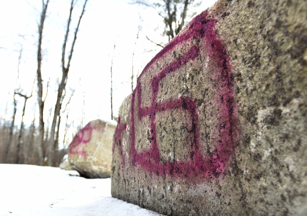 A swastika was painted on a rock at the Devil's Chair parking area at Quarry Road Recreation Area in Waterville, seen on Saturday, but city parks and recreation workers removed the symbol on Monday.