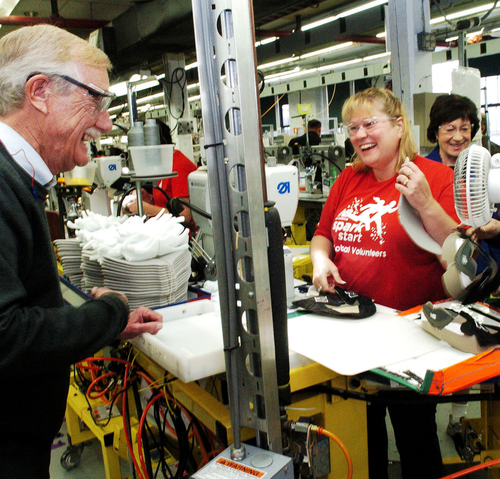 Sen. Angus King speaks with New Balance employee Bobbie-Jo Price as Sen. Susan Collins speaks with other employees during a tour of the Skowhegan factory Wednesday.