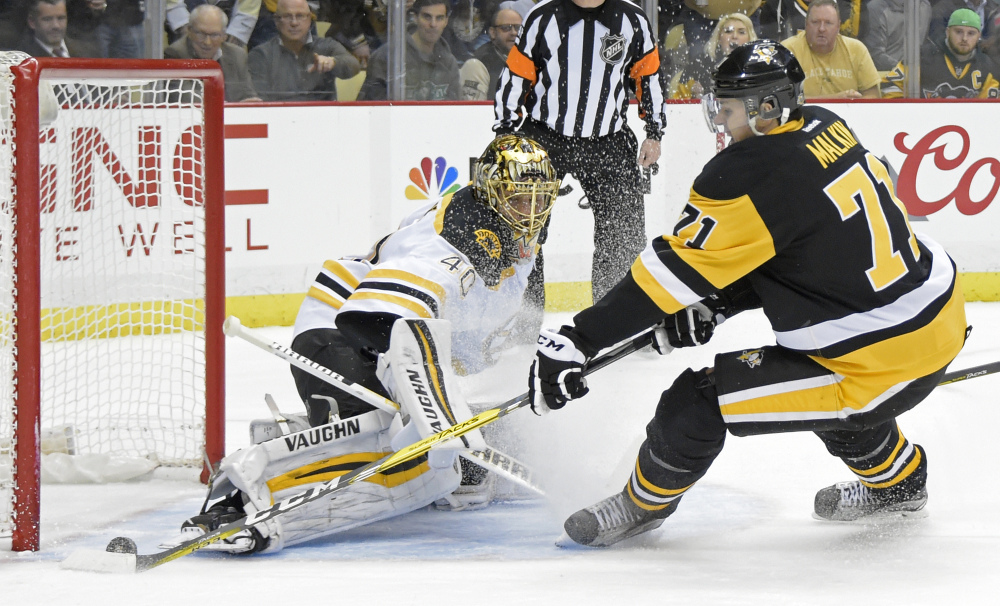 Bruins goalie Tuukka Rask stops a shot by Penguins center Evgeni Malkin in the second period of Wednesday night's game in Pittsburgh.