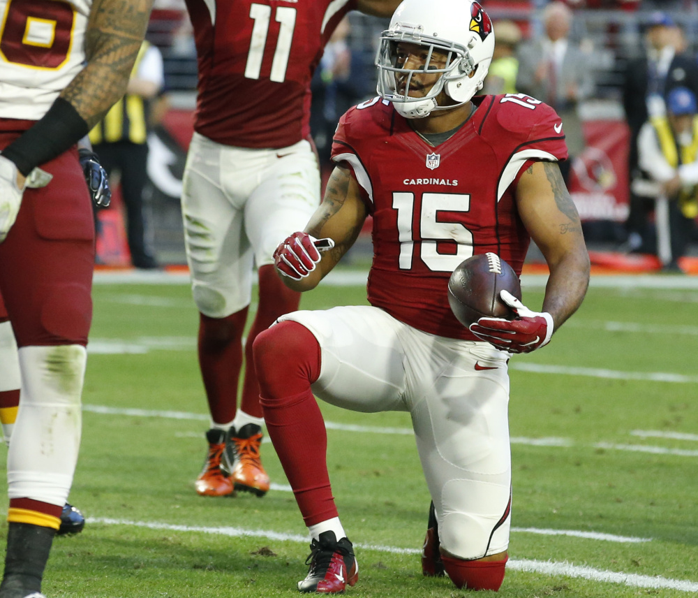 Arizona Cardinals wide receiver Michael Floyd (15) gets up after scoring a touchdown against Washington during the second half  Dec. 4 in Glendale, Ariz. (AP Photo/Ross D. Franklin)