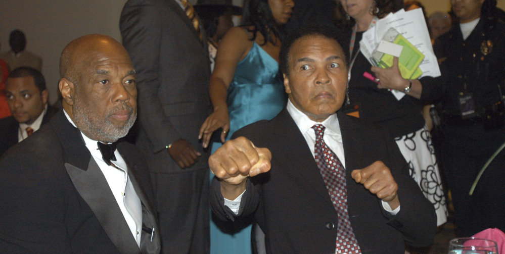 Photographer Howard Bingham, left, and longtime friend Muhammad Ali attend a reception.