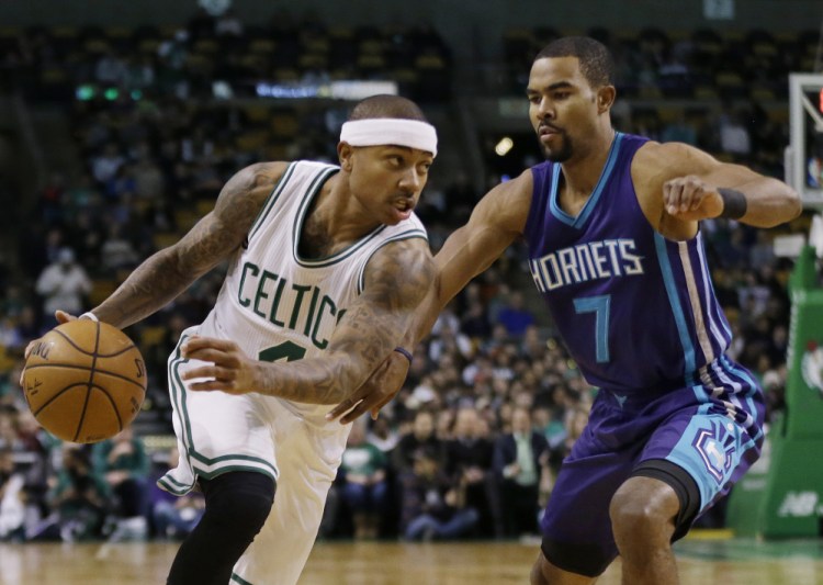 Celtics guard Isaiah Thomas drives against Hornets guard Ramon Sessions in the first quarter of Friday night's win for the Celtics in Boston. Thomas had 26 points in his return to action after sitting out four games with a groin injury.