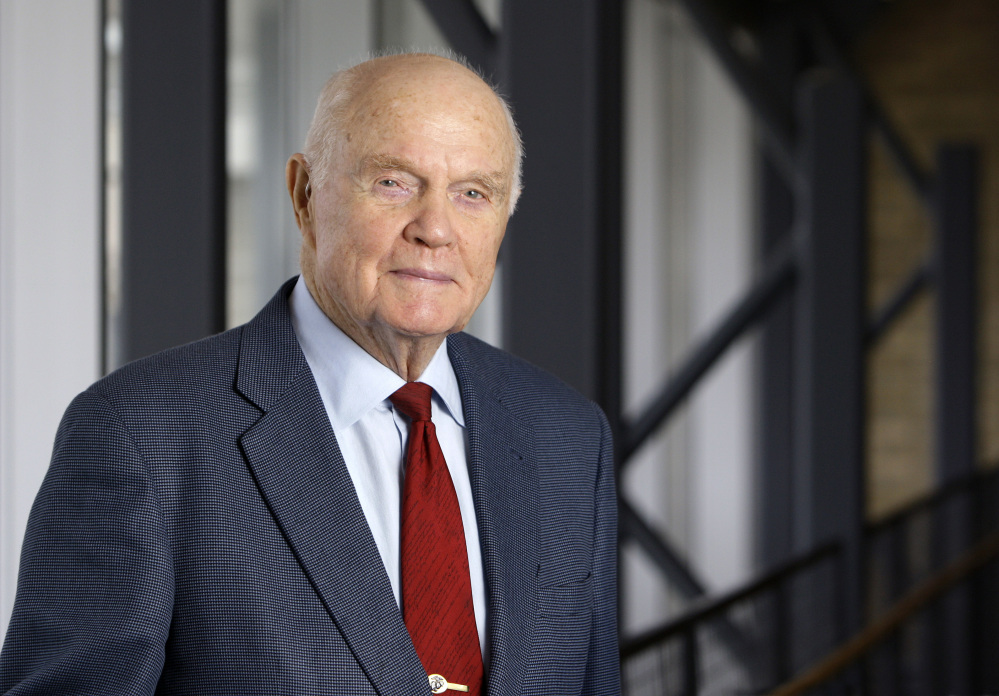 FILE - In this Jan. 25, 2012, file photo, John Glenn poses for a photo during an interview at his office in Columbus, Ohio. Glenn's home state and the nation will begin saying goodbye to the famed astronaut as he lies in state at Ohio's capitol building. A public viewing for the first American to orbit Earth is scheduled to stretch at least eight hours starting at noon on Friday, Dec. 16, 2016, in Columbus. The 95-year-old Glenn died last week. (AP Photo/Jay LaPrete, File)