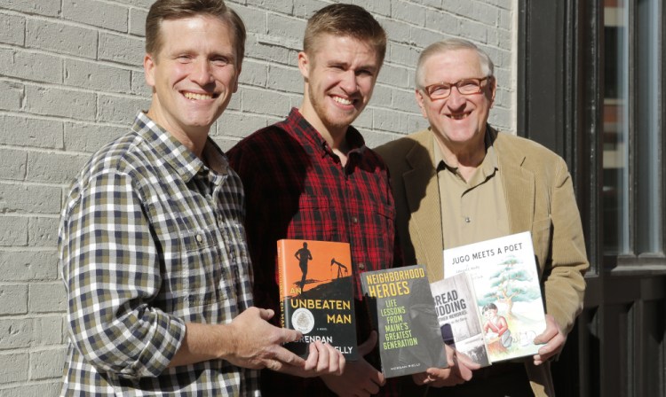 Brendan, left, Morgan and Edward Rielly with their books in Portland.