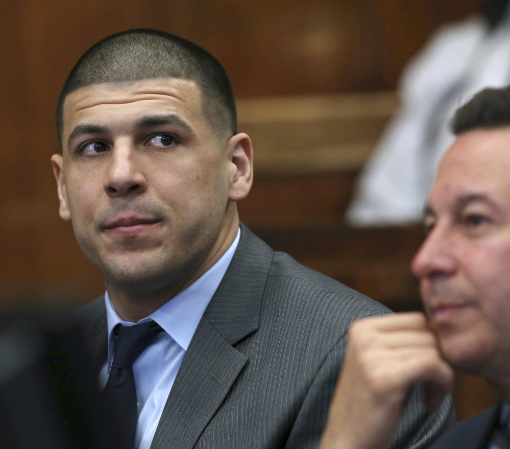 Former New England Patriots tight end Aaron Hernandez appears with defense attorney Jose Baez during a Tuesday hearing at Suffolk Superior Court in Boston.
