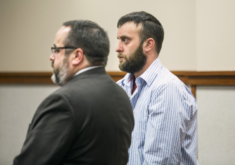 Jeffrey E. Smith Jr. stands with his attorney, Robert LeBrasseur, during a court appearance Wednesday. Smith is charged with leaving the scene of an accident that resulted in death, a felony.