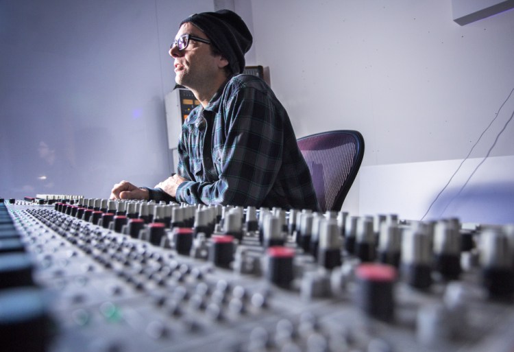 Nick Johnson, who plans to operate an all-analog recording studio in space he has secured on Anderson Street in Portland's East Bayside neighborhood, sits at the mixing board that he acquired in New Jersey.