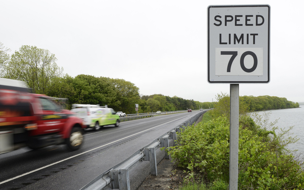 A 70 mph speed limit sign stands alongside the northbound lane of Interstate 295 after Tukey's Bridge in Portland.