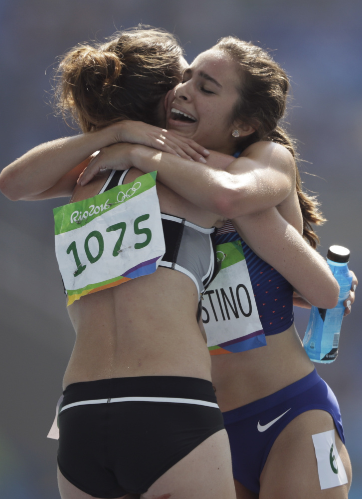 New Zealand's Nikki Hamblin, left, and Abbey D'Agostino of the United States got their feet tangled in a 5,000-meter heat at the Olympics in Rio, and both went sprawling. D'Agostino got up and instead of trying to get back into the race, crouched down and helped Hamblin rise to finish the race.