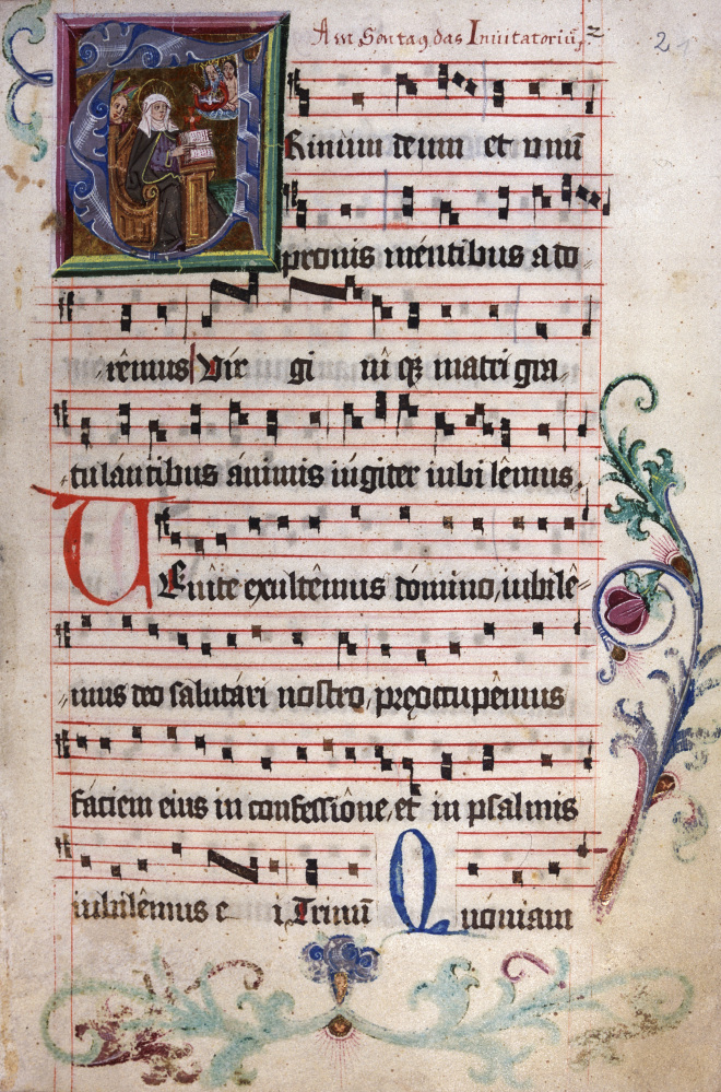 The library of the abbey holds volumes and manuscripts like this song book that are rich with colorful religious decoration.