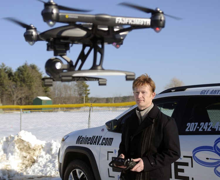 Photographer Thomas-john Veilleux operates a drone last week in Augusta while discussing the technological and regulatory hurdles he met to expand his business.