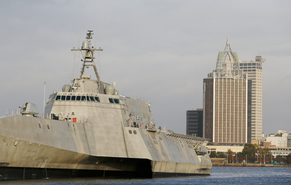 The cityscape of Mobile, Ala., is seen behind the docked USS Gabrielle Giffords, a Naval littoral combat ship built at the Austal USA shipyards on the Mobile River. The ship is named in honor of former U.S. Rep. Gabrielle "Gabby" Giffords of Arizona.