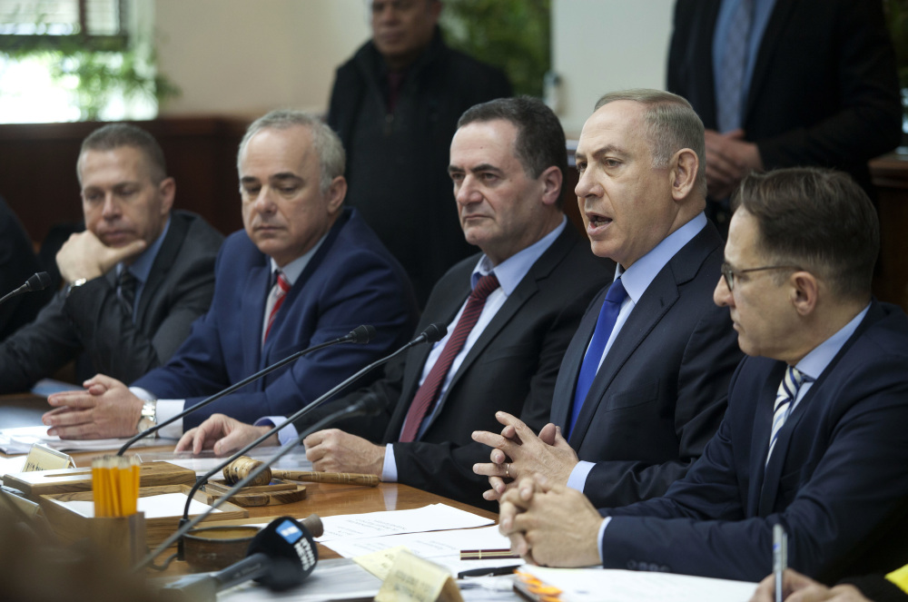 Israeli Prime Minister Benjamin Netanyahu, second right, attends a weekly Cabinet meeting in Jerusalem on Sunday. Netanyahu called a recent U.N. resolution "shameful" and accused the U.S. of playing an active role in its passage.
