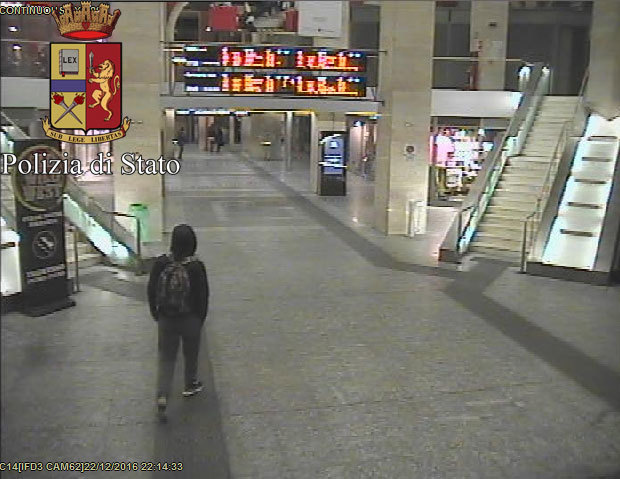 In this image from video made available by Italian police, Anis Amri, the suspected truck driver in Berlin's deadly Christmas market attack, walks through the Milan train station Dec. 22.
