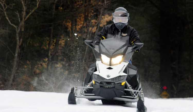 Alan Swett, Maine Snowmobile Association safety chairman, takes a spin Thursday in Augusta.