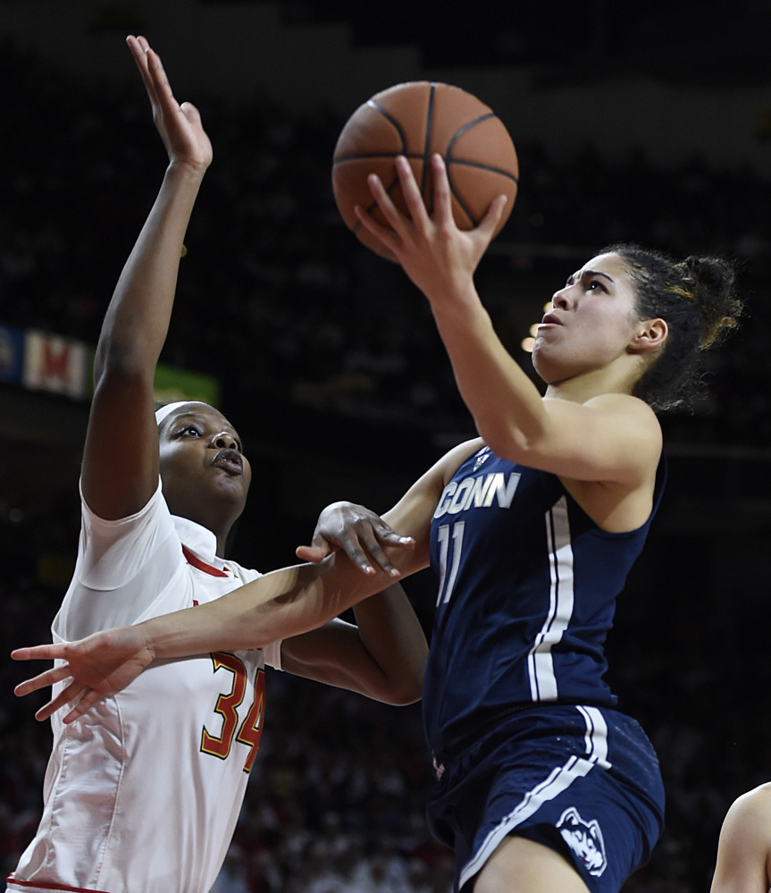 Kia Nurse of Connecticut heads to the basket Thursday night against Brianna Fraser of Maryland during the second half of Connecticut's 87-81 victory.