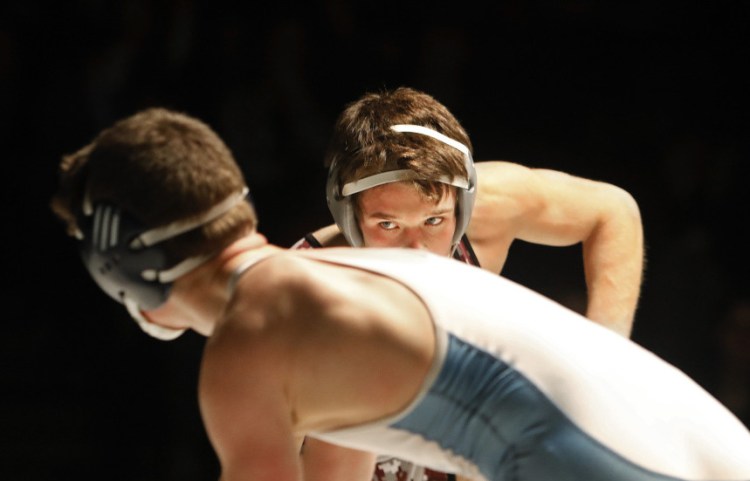 Jake Martel of Noble stares down his opponent, Dan Bliss of Mt. Mansfield in Vermont, during the Noble Invitational on Friday. Martel, who won the 132-pound division, defeated Bliss, a two-time Vermont state champion, 9-6. Noble captured the team championship.