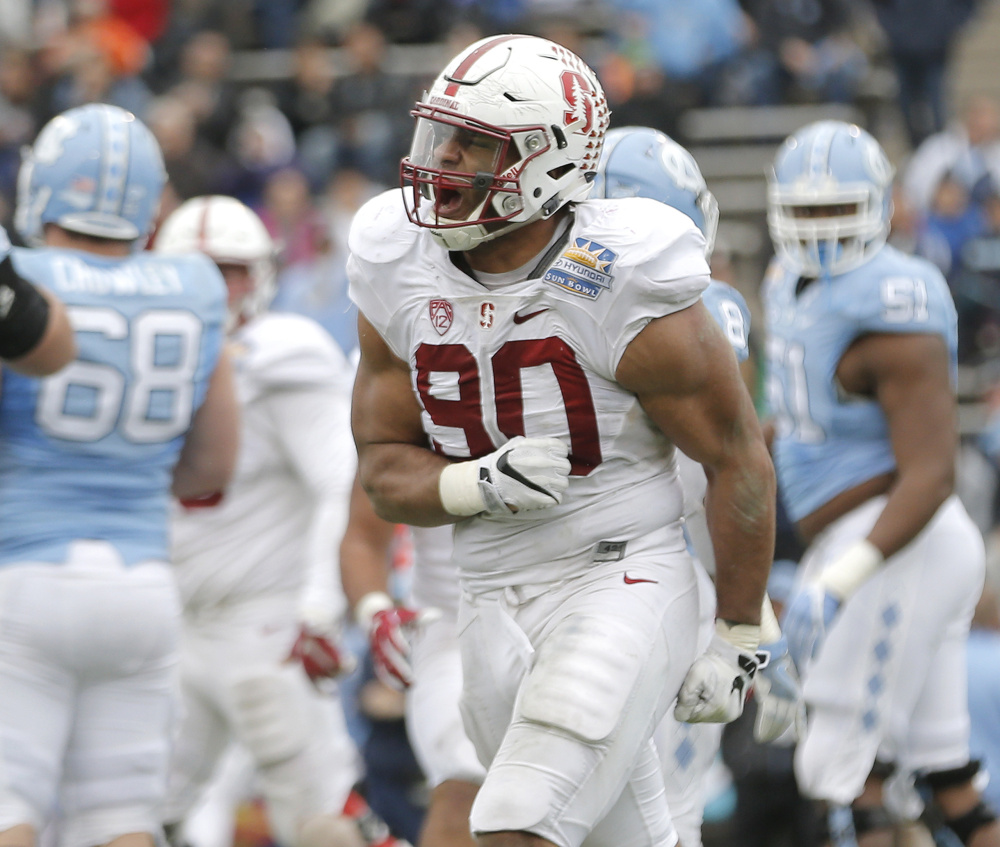 Stanford's Solomon Thomas celebrates after sacking North Carolina quarterback Mitch Trubisky on a 2-point conversion attempt that would have tied the Sun Bowl.