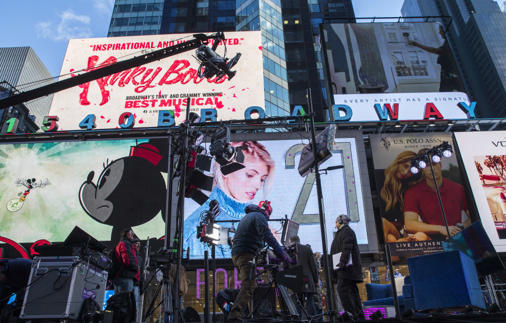 Technicians prepare a stage planned for use in the New Year's celebration in New York's Times Square on Saturday night. Just 18 percent of Americans said things for the country got better in 2016.