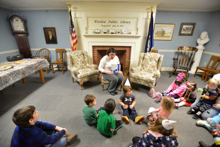 New Year's comes early at Winslow Public Library, with Samantha Cote reading a story to kids who can't stay up.