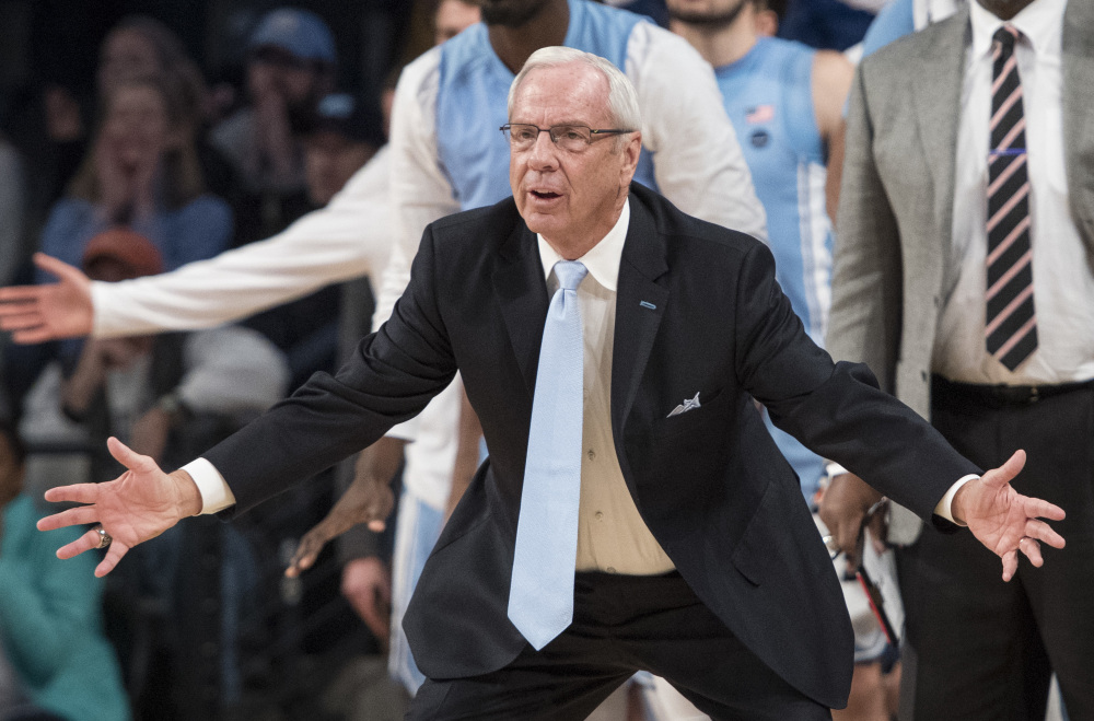 North Carolina Coach Roy Williams urges on his team in the final moments of its game against Georgia Tech on Saturday in Atlanta. The Tar Heels, the ninth-ranked team in the country, were upset 75-63.