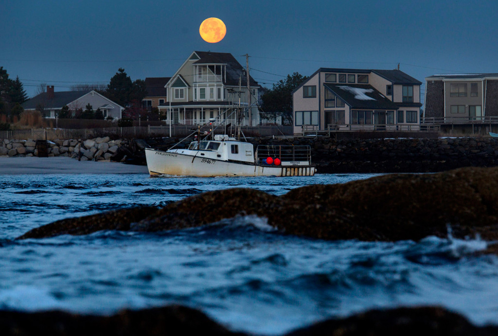 The fishing vessel Persistence leaves the Scarborough River as it heads past Pine Point in Scarborough under a full moon on Wednesday morning. 