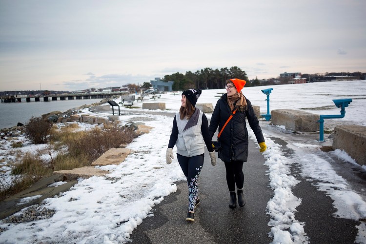 Holly Martzial, left, of South Portland and Malorrie Nadeau of Bath walk along the path at Bug Light Park in December 2016. A construction project to begin in 2018 will build two bridges to close a short gap between the Scarborough and South Portland sections of the Eastern Trail.