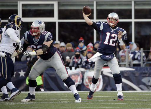 New England Patriots quarterback Tom Brady (12) passes against the Los Angeles Rams during the second half of a game on Sunday, Dec. 4, 2016, in Foxborough, Mass. 
