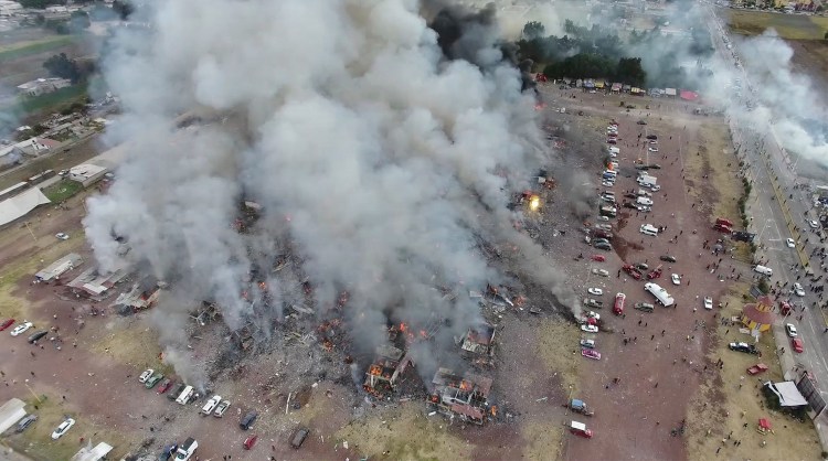 This image made from video shows a view from a drone of smoke billowing from the San Pablito Market, where an explosion ripped through a fireworks market Tuesday.
Pro Tultepec via APTN